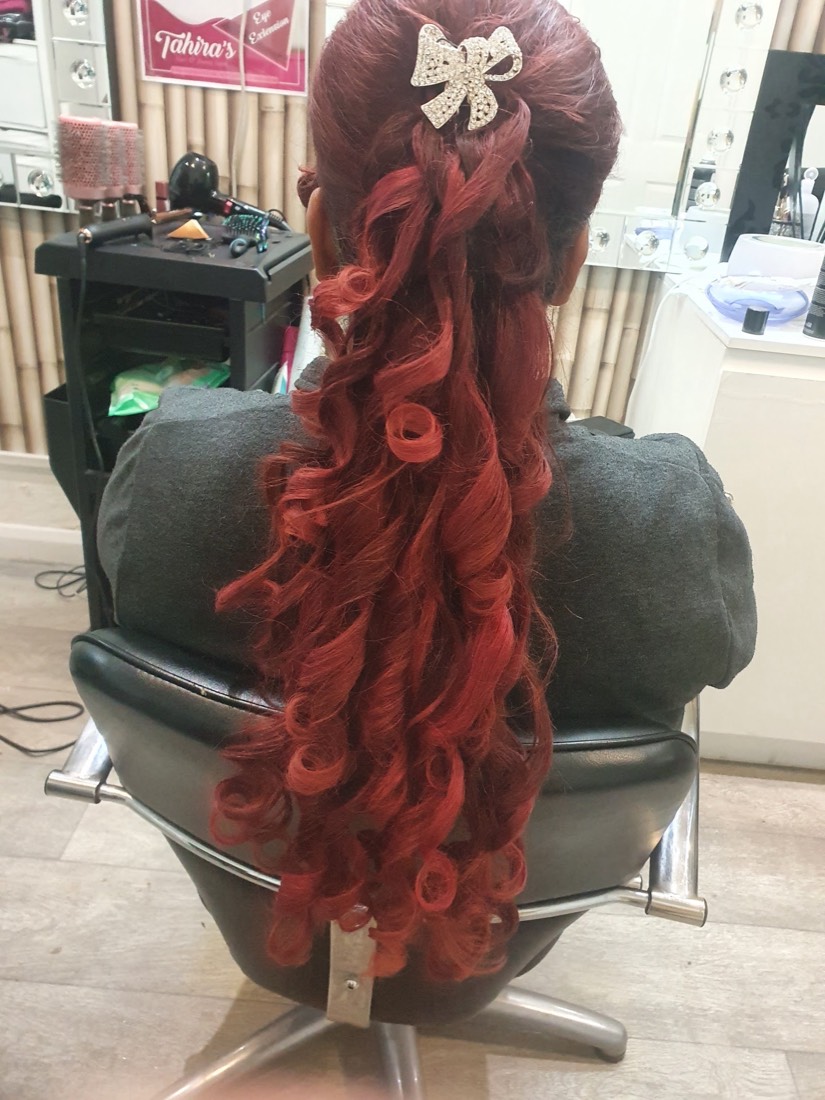 Deep-red occasion curls set with a diamanté bow